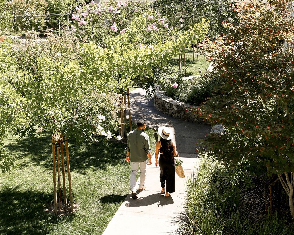 Couple Walking Through MacArthur Place Grounds